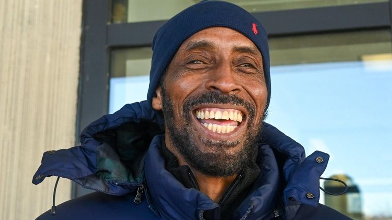 Rodolfo Taylor smiles outside Suffolk County Court in Riverhead in January.