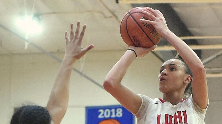 Celeste Taylor #12 of Long Island Lutheran pulls up for...