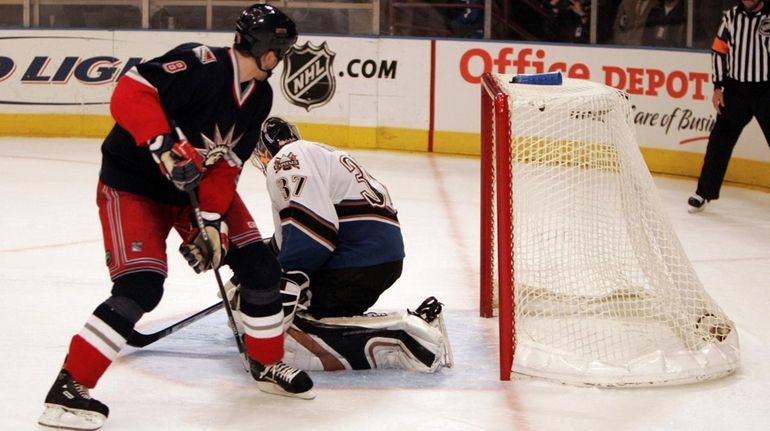 The Rangers' Marek Malik scores a shootout goal against the...