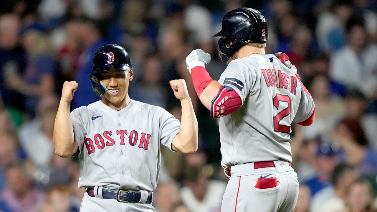 Justin Turner of the Boston Red Sox laughs after an at bat against