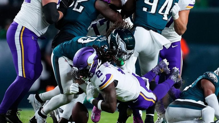 Minnesota Vikings running back Alexander Mattison (2) fumbles the ball...