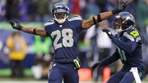 The Seattle Seahawks' Byron Maxwell, right, smiles as he joins...