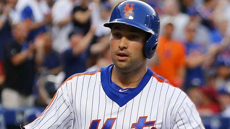 Neil Walker #20 and Yoenis Cespedes #52 of the New...