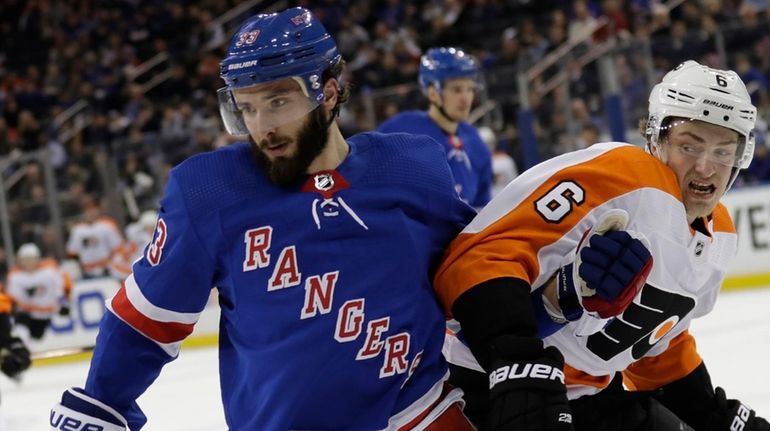 The Rangers' Phillip DiGiuseppe, left, and the Flyers' Travis Sanheim...