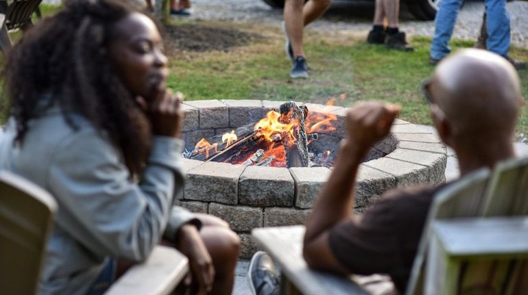 Lounge on Adirondack chairs near the firepit while sipping cider...