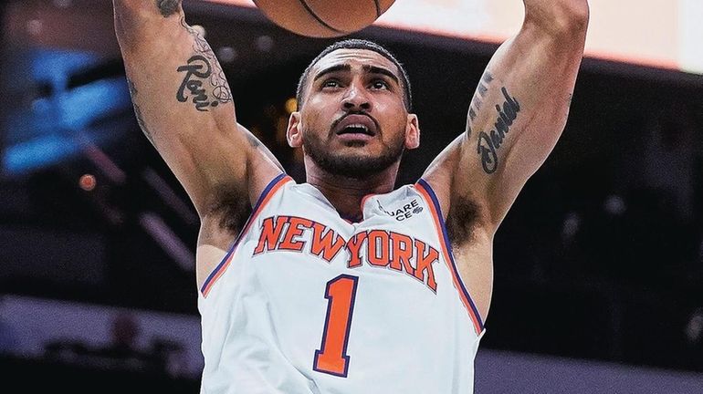 Knicks forward Obi Toppin dunks during the second half of...