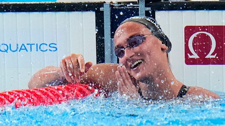 Simona Quadarella of Italy celebrates after winning the gold medal...