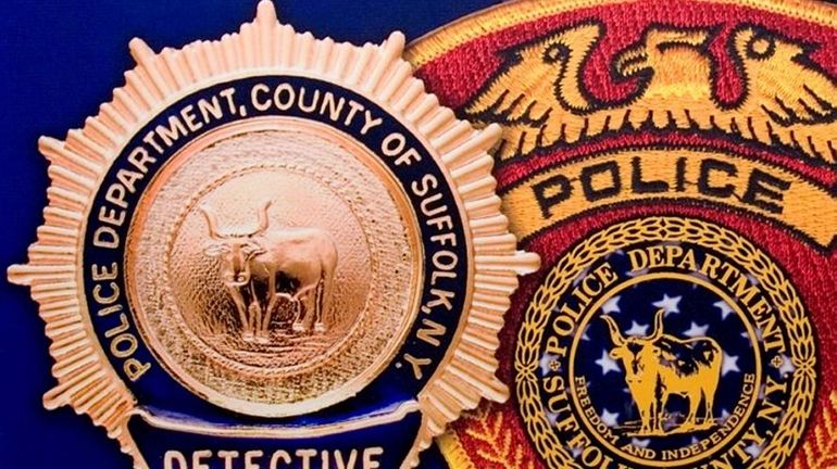 This file photo shows the detective shield and patch of...