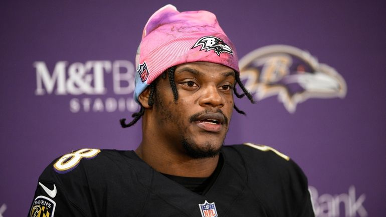 FILE - Baltimore Ravens quarterback Lamar Jackson speaks to the...