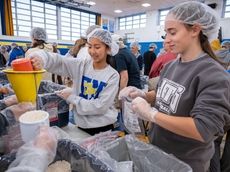 East Meadow student athletes package 20,000 meals for people in need