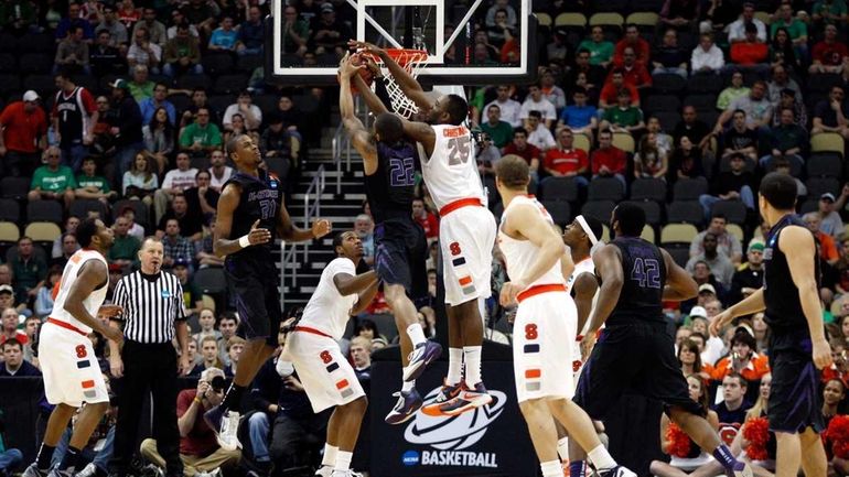 Rodney McGruder #22 of the Kansas State Wildcats attempts to...