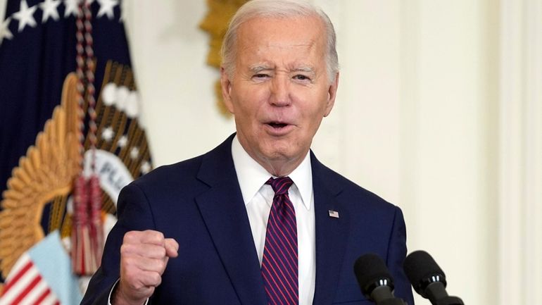 President Joe Biden speaks in the East Room, Jan. 19,...