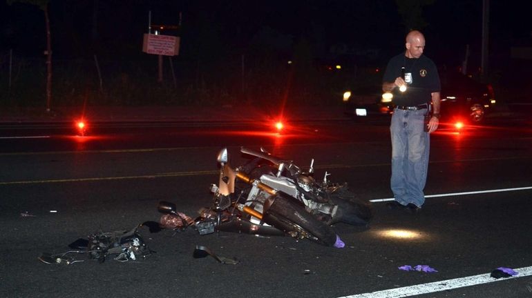 Suffolk County police investigate a motorcycle accident on Middle Country...