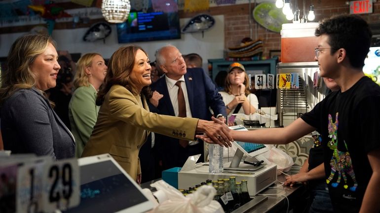 Democratic presidential nominee Vice President Kamala Harris and running mate...