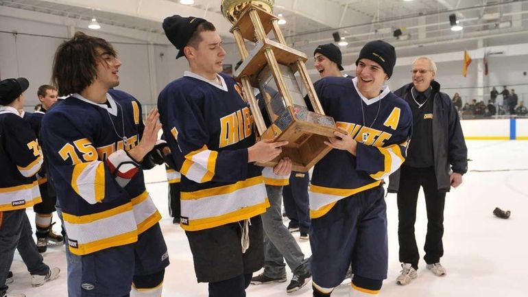 Massapequa's Phil Armato, Justin Von Wieding and Dom DiGiovanna carry...