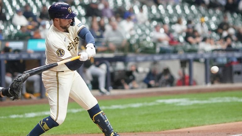 Milwaukee Brewers' Rhys Hoskins hits a single during the second...