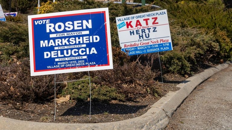 Election signs in Great Neck Plaza for the trustee and...