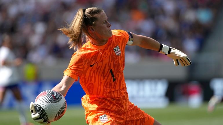 United States goalkeeper Alyssa Naeher throws the ball across the...