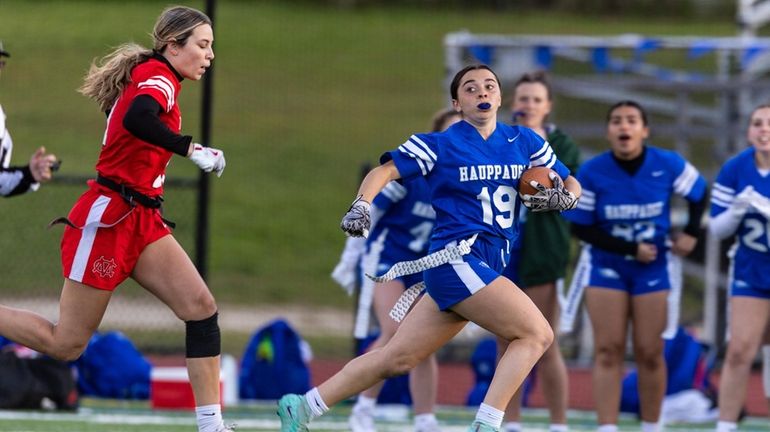 Meghan Goutink of Hauppauge runs past the Center Moriches defense...