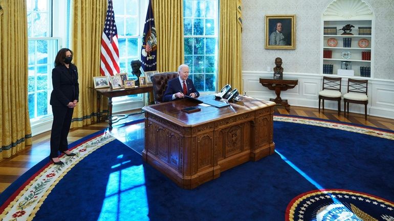 TOPSHOT - US President Joe Biden, with Vice President Kamala...