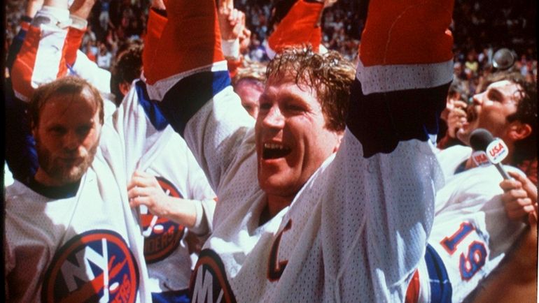 Denis Potvin hoists the Stanley Cup on May 30, 1983,...