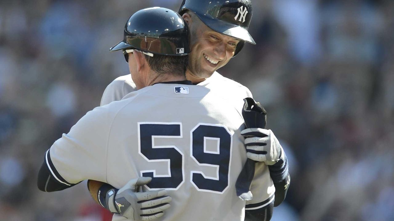 United States captain Derek Jeter reacts after being hit by a ball