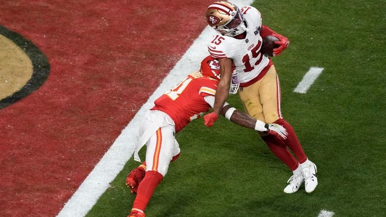 San Francisco 49ers wide receiver Jauan Jennings (15) scores past...