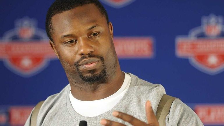 Jets linebacker Bart Scott talks to the media after practice...