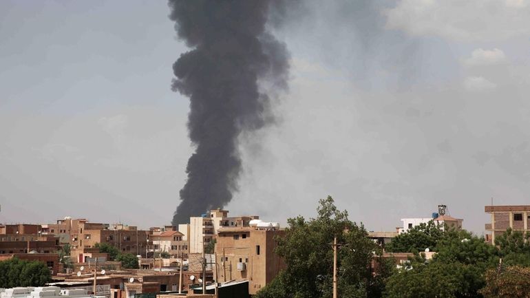 Smoke rises over Khartoum, Sudan, Thursday, June 8, 2023, as...