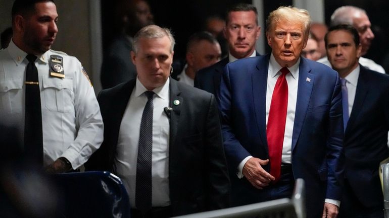 Former President Donald Trump leaves Manhattan criminal court, Thursday, Feb....