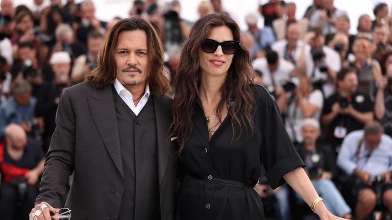 Johnny Depp and director Maïwenn pose for photographers during a media...