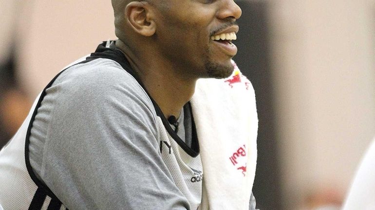 Jerry Stackhouse sits on the bench during practice at the...