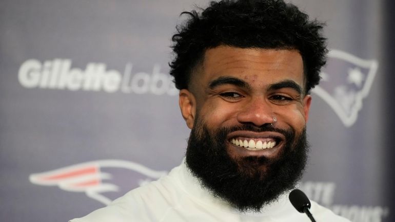 New England Patriots running back Ezekiel Elliott (15) speaks during...