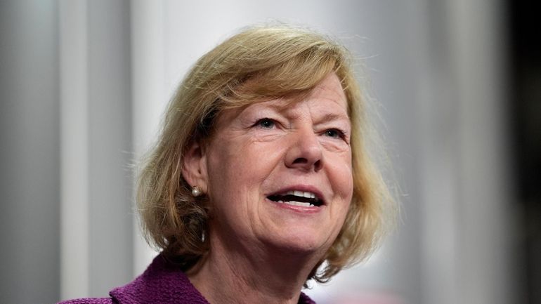 Sen. Tammy Baldwin, D-Wis., speaks before President Joe Biden, Jan....