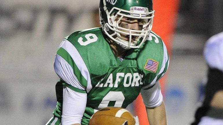 Seaford's Kyle Kolodinsky intercepts the ball and runs for a...