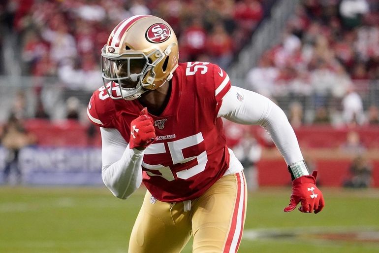 Green Bay Packers running back Aaron Jones (33) runs in front of San  Francisco 49ers cornerback Richard Sherman (25) and strong safety Jaquiski  Tartt (29) during the NFL football NFC Championship game