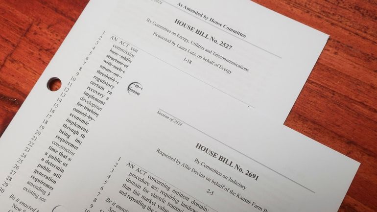 Two of the dozens of Kansas House bills that now...