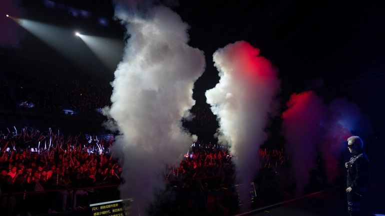 Chinese rapper Boss X performs at a concert in Chengdu...