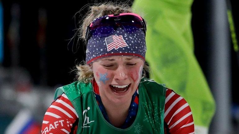 Jessica Diggins celebrates after winning the gold medal in the...