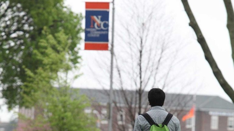 A student walks through the campus of Nassau Community College...