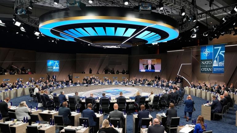 Leaders take their seats for a meeting of the NATO-Ukraine...