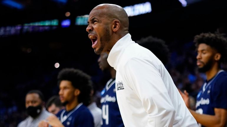 St. Peter's head coach Shaheen Holloway reacts during the first...