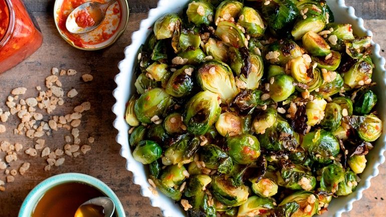 Roasted Brussels sprouts with a sweet chili dressing and crisped...