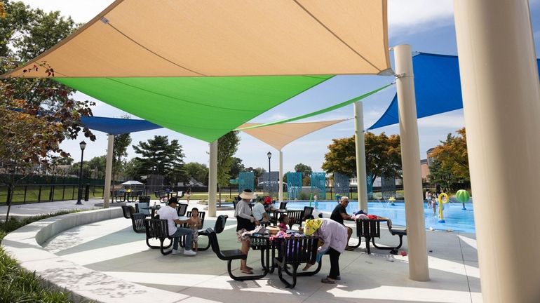 Locals enjoy the outdoors at Charles Fuschillo Park in Carle...