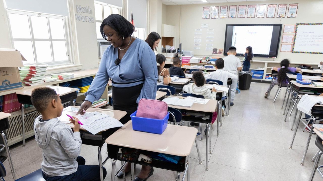 teaching-assistants-at-jackson-main-school-help-students-with-their