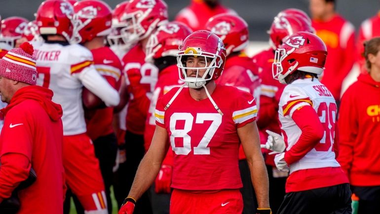 Kansas City Chiefs tight end Travis Kelce (87), centre, attends...