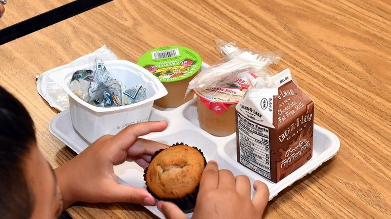 A child has breakfast Wednesday at William E. DeLuca Jr. Elementary...