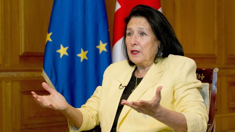 Georgian President Salome Zourabichvili gestures while speaking during an interview...