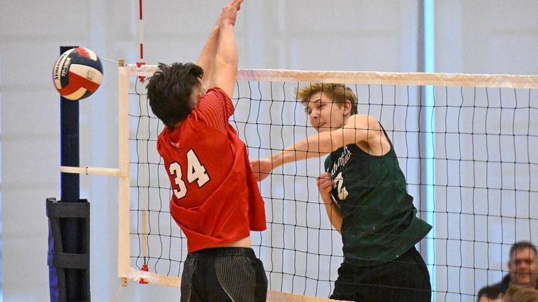 Westhampton Beach's Casey Sidor (2) spikes the ball against Jamesville...