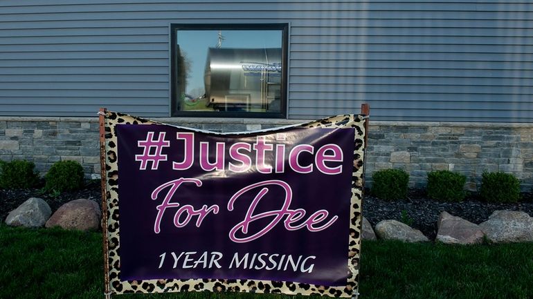 A banner calls for justice in the case of missing...